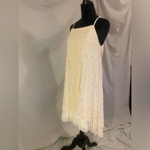 Brand new beach-boutique dress. Size large. Halter style next, lace overlay.